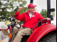 President Barchi aboard a tractor
